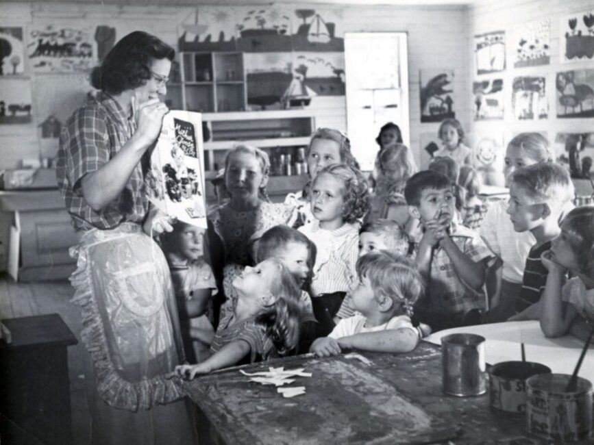 A black and white photo of a classroom demonstration