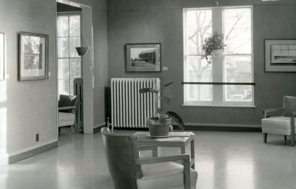 A black and white photo of the Wustum Museum's interior