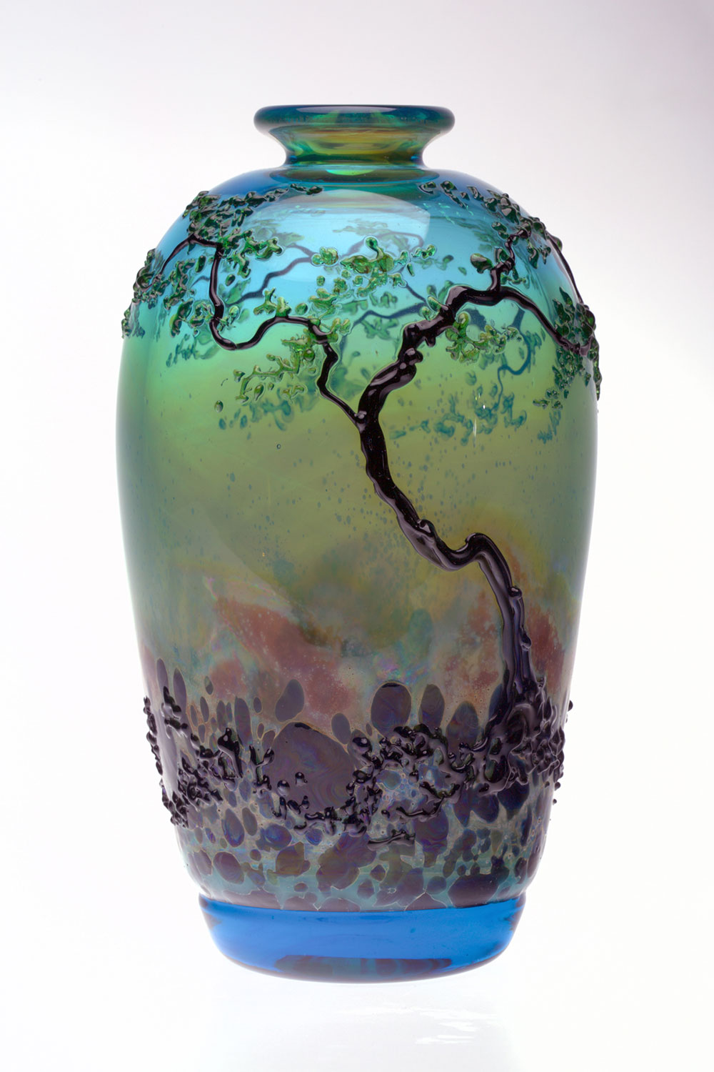 Glass vase with a protruding tree design