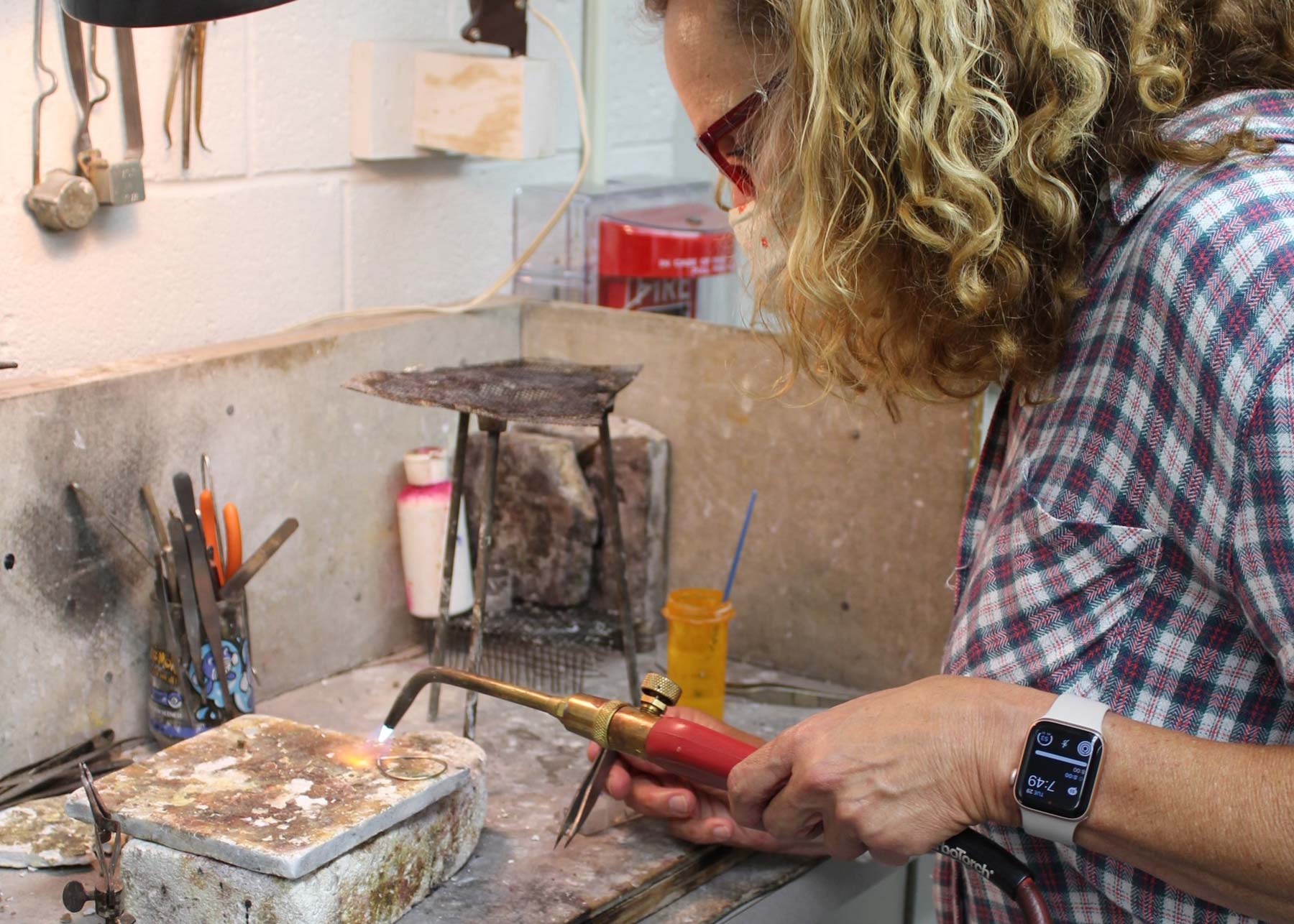 Woman soldering jewelry