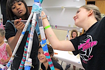 featSummer camp girls working on sculpture