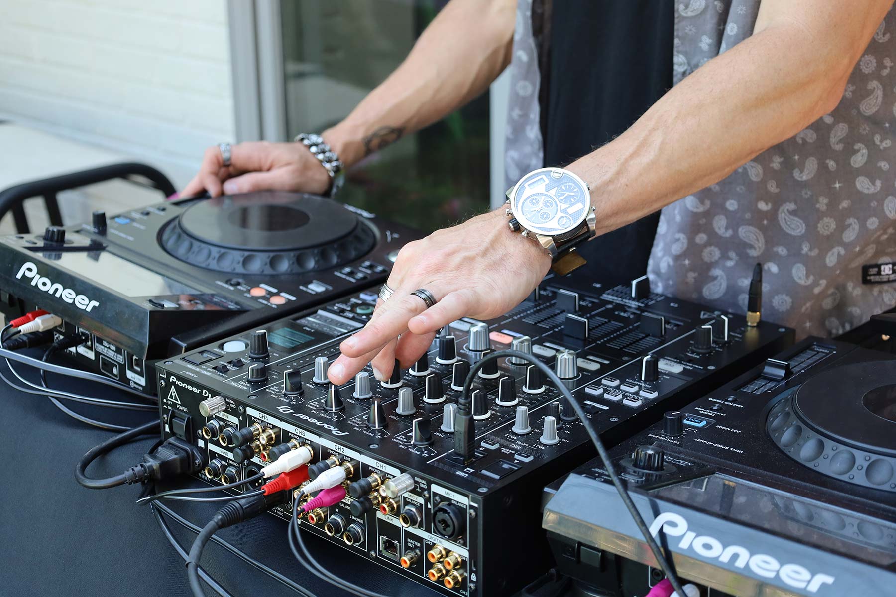 DJ adjusting knobs on their music equipment