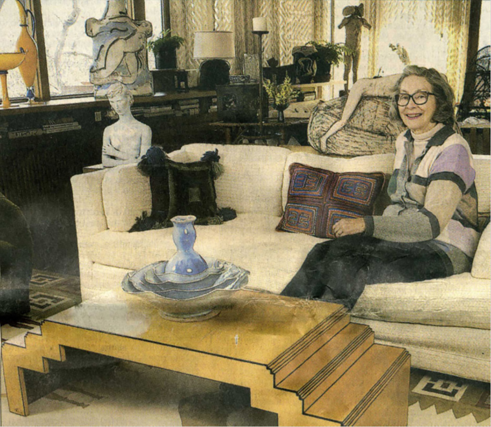 Karen Johnson Boyd on a couch in her home, surrounded by several sculptural forms